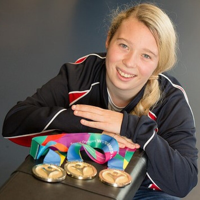 Athlete Kiera Byland with her medals won from competing in the Special Olympics World Games