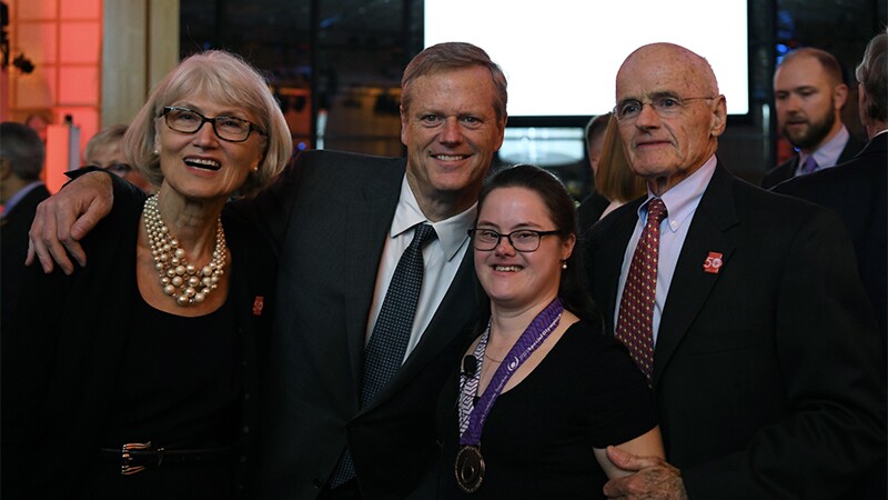 Melissa Reilly and her parents standing with current Governor Charlie Baker.
