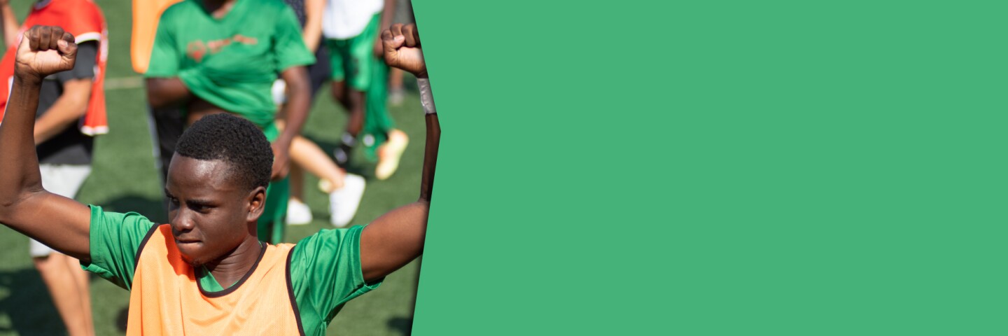 Young man cheering on the football field.