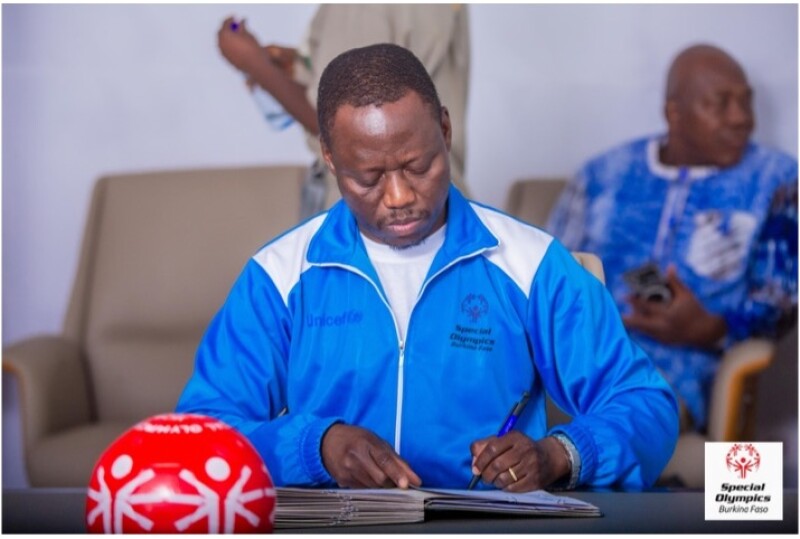 The Honorable Roland Somda, Minister of Sport, Youth, and Employment of Burkina Faso, signs the Memorandum of Understanding to join the Special Olympics Global Coalition for Inclusion.