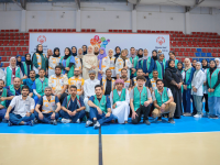 large group of people in a gymnasium. 