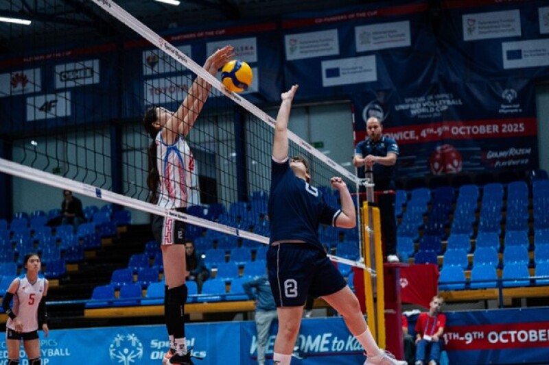 Marija jumps up to block the ball during a match with Mongolia