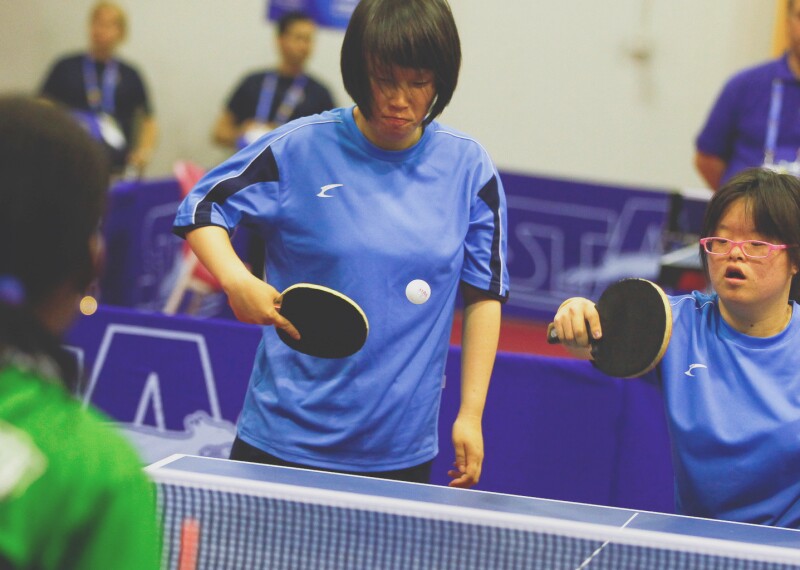 Tennis Table female pairs teams competing.