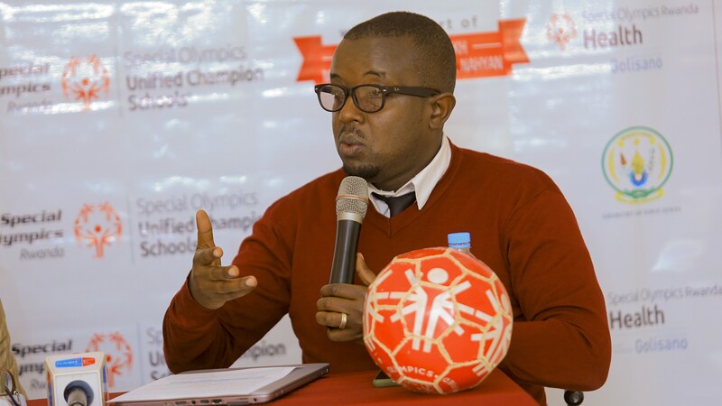 Man speaking into a microphone.