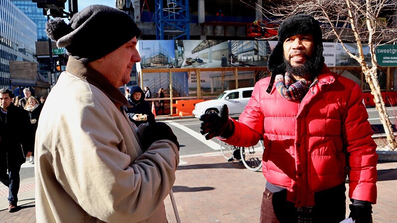 Ben Collins and Anthony Dinkins stand at crosswalk.