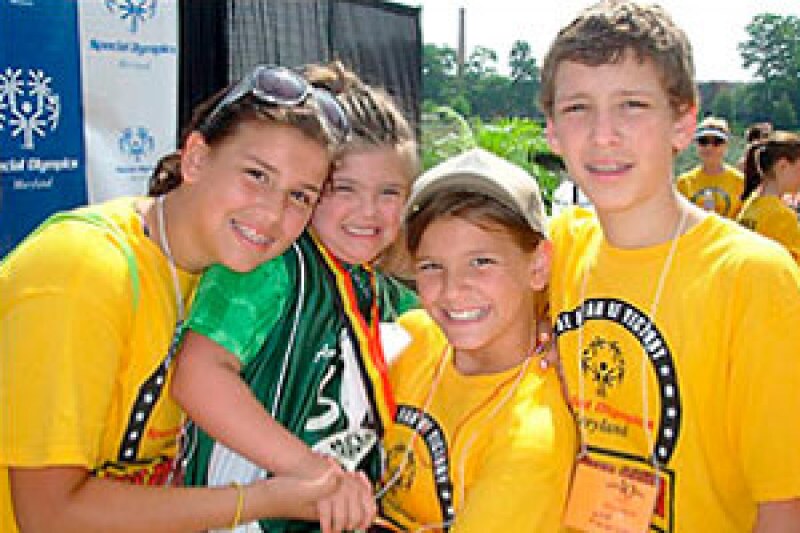Rosa Marcellino, 9, second from left, is shown with siblings Maddie, 13, Gigi, 11, and Nick, 15, during the Special Olympics state games, held in June. Rosa has Down syndrome and is the inspiration behind “Rosa’s Law” that removes the terms "mentally retarded" and “mental retardation" from federal education, health and labor laws.