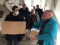 people carrying boxes. 