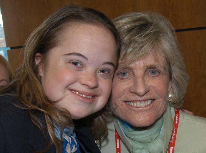 Katie Meehan and Ambassador Jean Kennedy Smith with their heads together and smiling. 