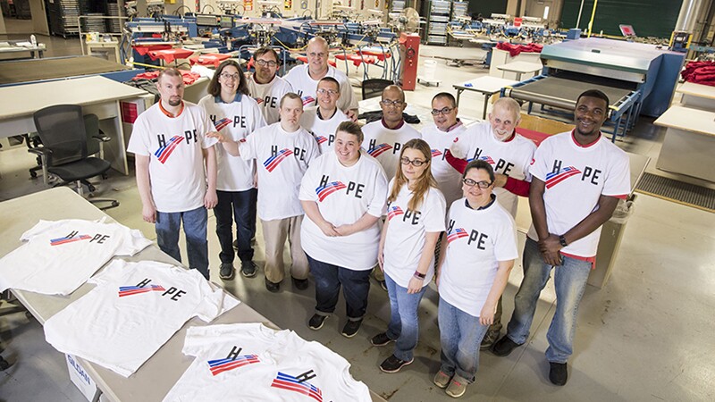 2018 SO Hope T-Shirt Story Shoot. Standing in a group on the work room floor: Bank of America Employee: Gabe Lotz, Andrea Moore, Brent Pfister, Daniel Gleeson, Matt Planer, Amanda Perry, Mark Reeves, Lisa Sadlowski, Wilson Caraballo, Kristin O'Grady, Fred Mammele, Tinielle Spicer-Watson (Current as of 10/15/18)