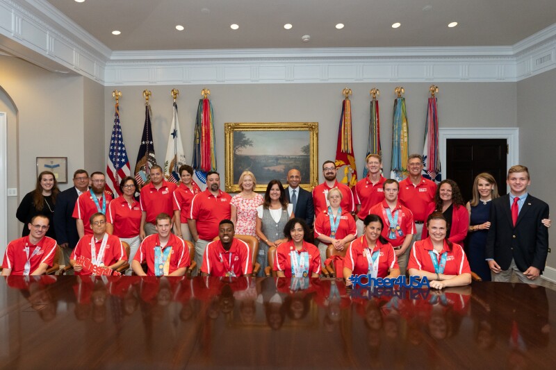 20 members of the Special Olympics USA delegation that competed at Special Olympics World Games Abu Dhabi 2019 pose in the Roosevelt Room prior to their visit with the President and Vice President. The group of dignitaries included the Second Lady (middle), His Excellency Yousef Al Otaiba, United Arab Emirates Ambassador to the United States (right), Special Olympics CEO Mary Davis (left), and Abigial Blunt, Spouse of Senator Roy Blunt, and Charlie Blunt, son of Senator Roy Blunt (far right).