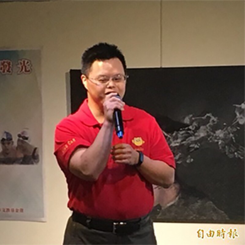 Michael Fan delivering a speech.
