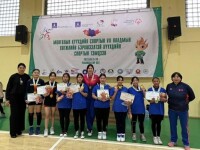 Athletes standing side by side for a group photo. 