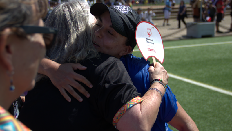 two women embracing each other 