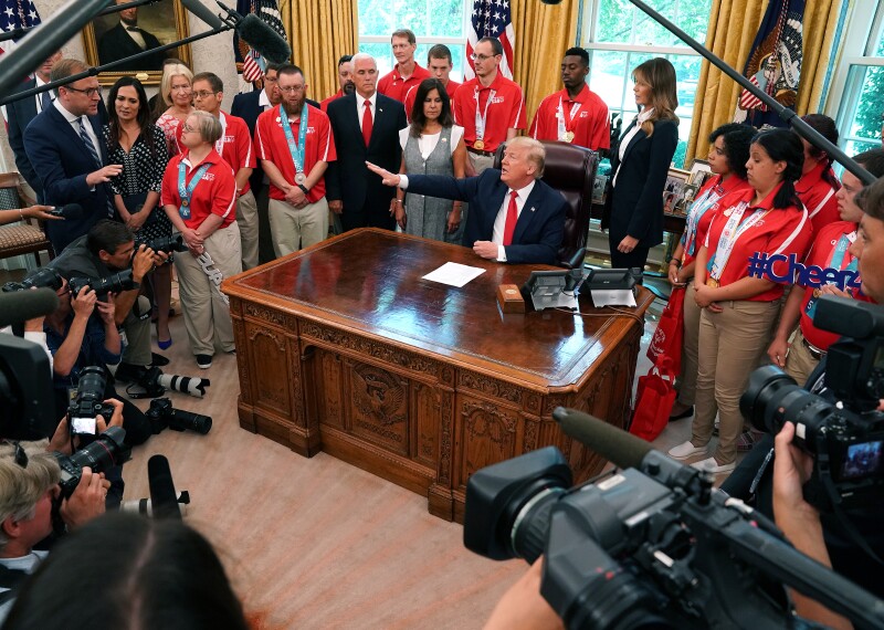 U.S. President Donald Trump, center, speaks during a meeting with members of the delegation that represented the USA at Special Olympics World Games Abu Dhabi 2019 in the Oval Office of the White House in Washington, D.C., U.S., on Thursday, July 18, 2019.