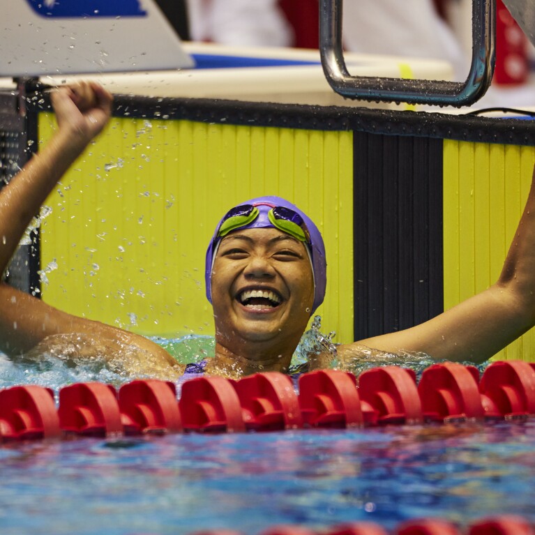 Swimmer celebrating in the water