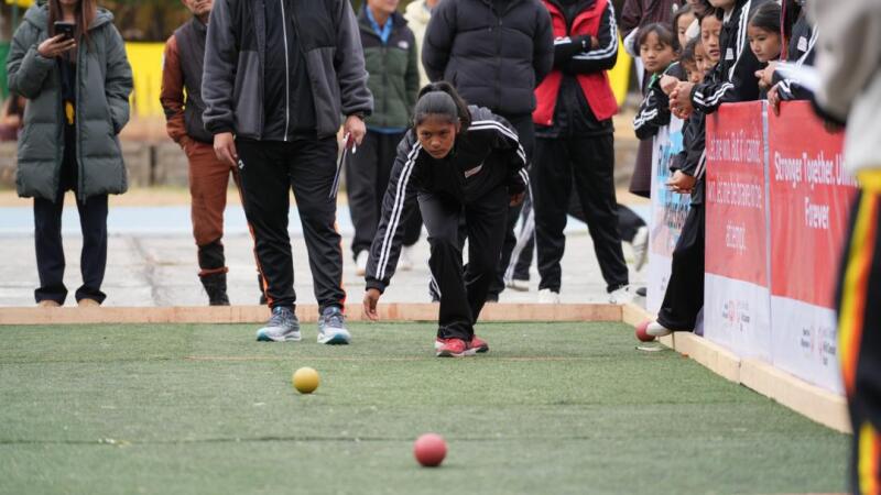 Athletes playing bocce. 