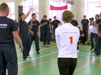 Athletes standing in a circle hitting the ball around. 