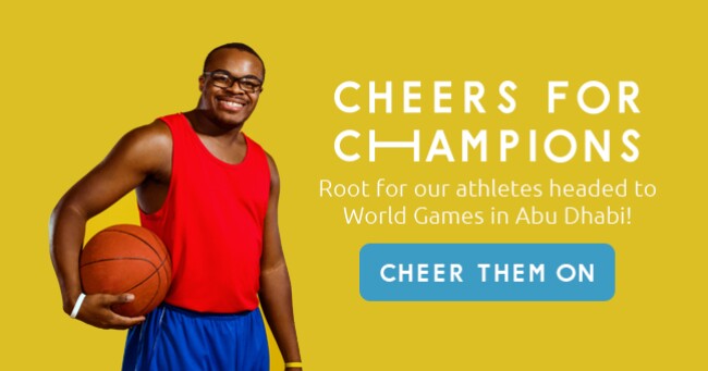 A photo of a smiling Special Olympics basketball player