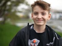 young man walking and smiling