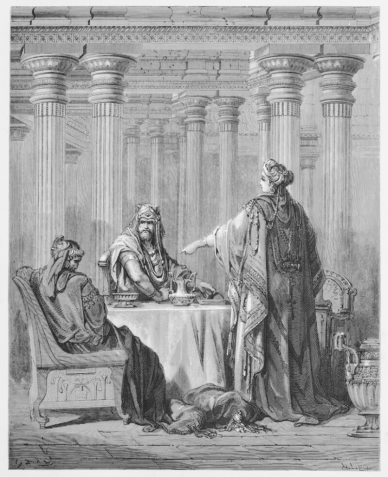 This black and white photo shows a woman standing and speaking to two individuals.