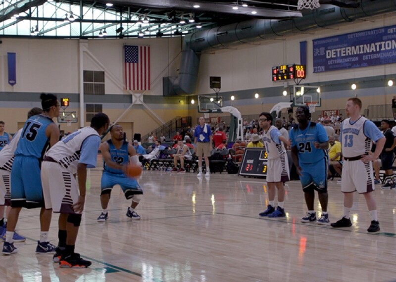 Man making free through on the basketball court. 